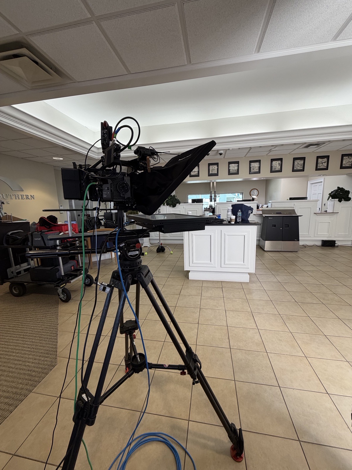 Camera jib with through-glass teleprompter on an interior commercial shoot